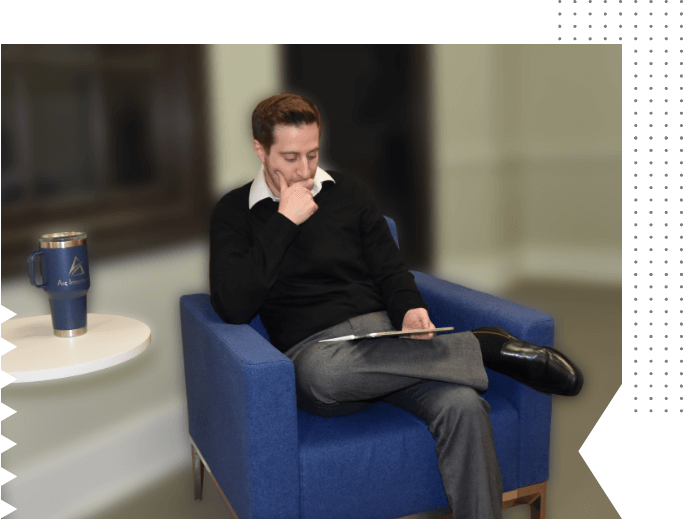 Matt sitting in a chair, thinking and working