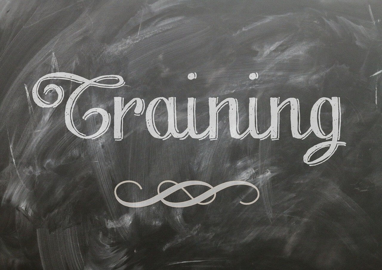 The word “training” on a chalkboard