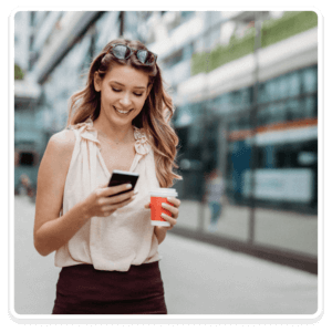 Woman with coffee on phone